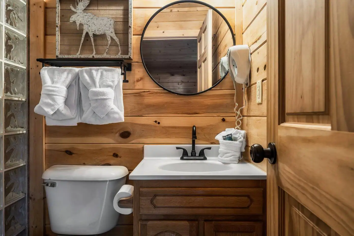 Fully equipped bathroom with hair dryer.