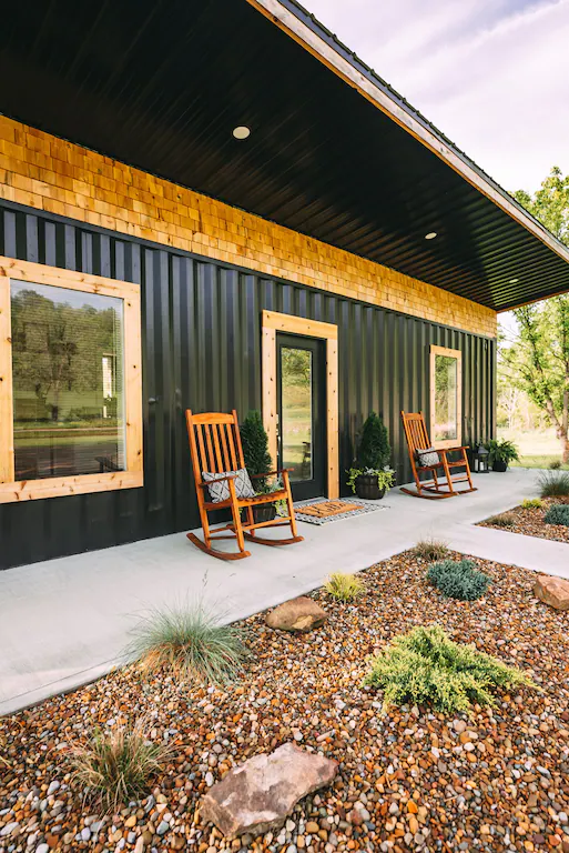 The front porch contains rocking seats that are ideal for viewing the sun set behind the hills.