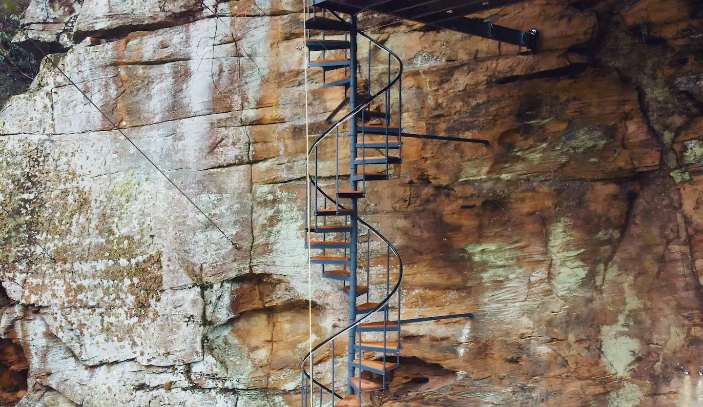 The spiral staircase leading to the suspended master suite