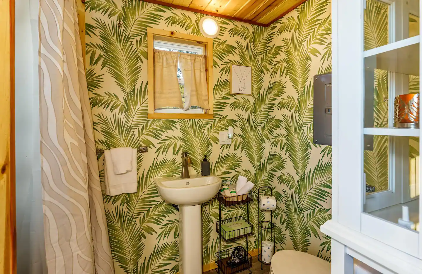 View of the restroom from the entrance to the hand washing station.