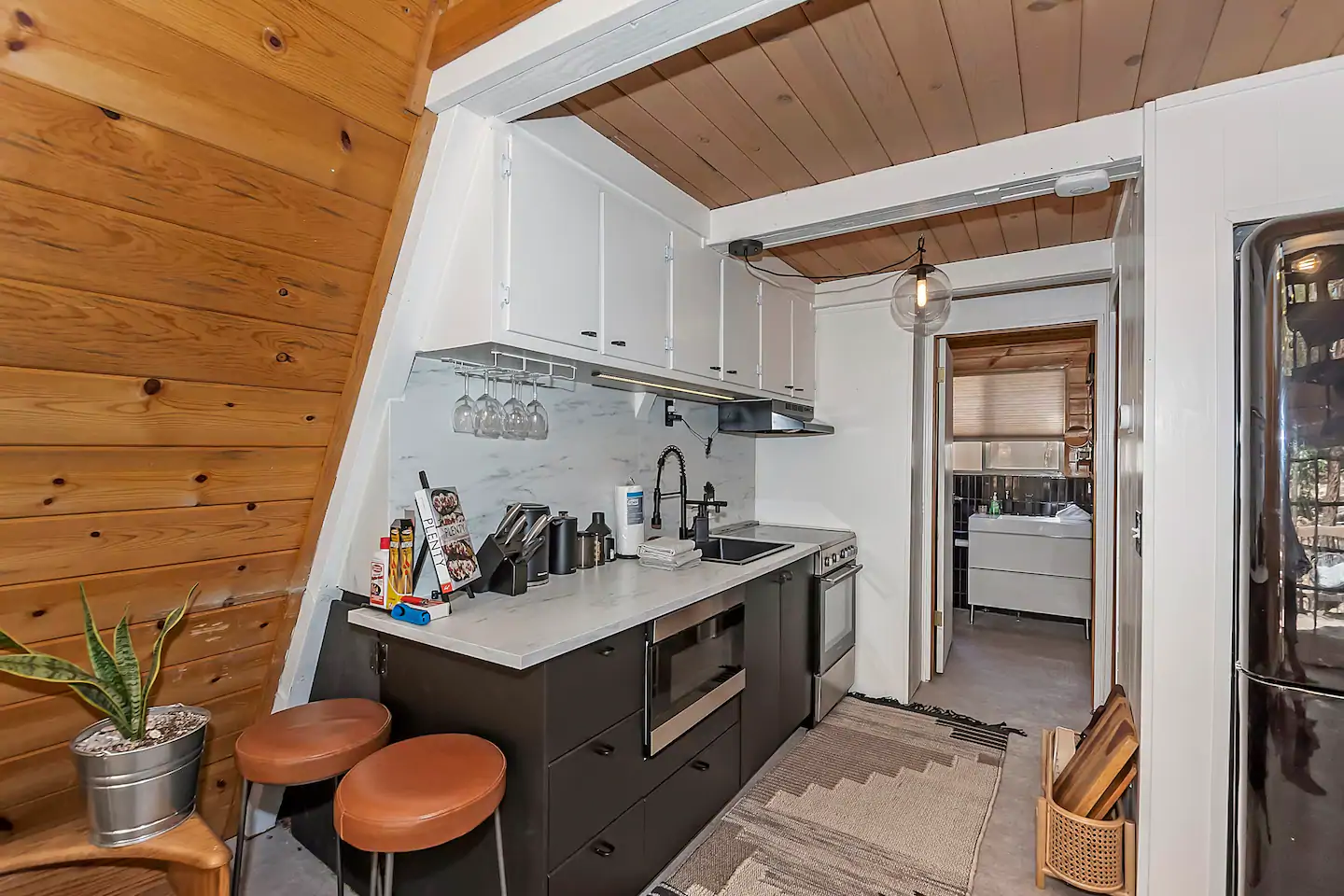 The kitchen is fully supplied with everything you'll need to enjoy your stay.