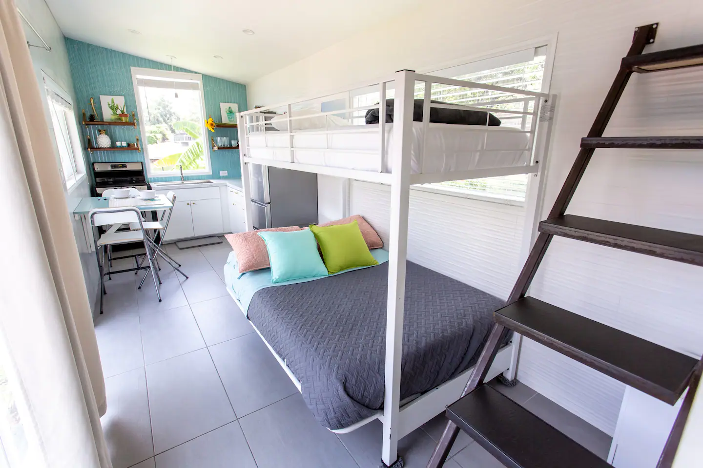 The lower bed converts into a sofa for extra sitting.