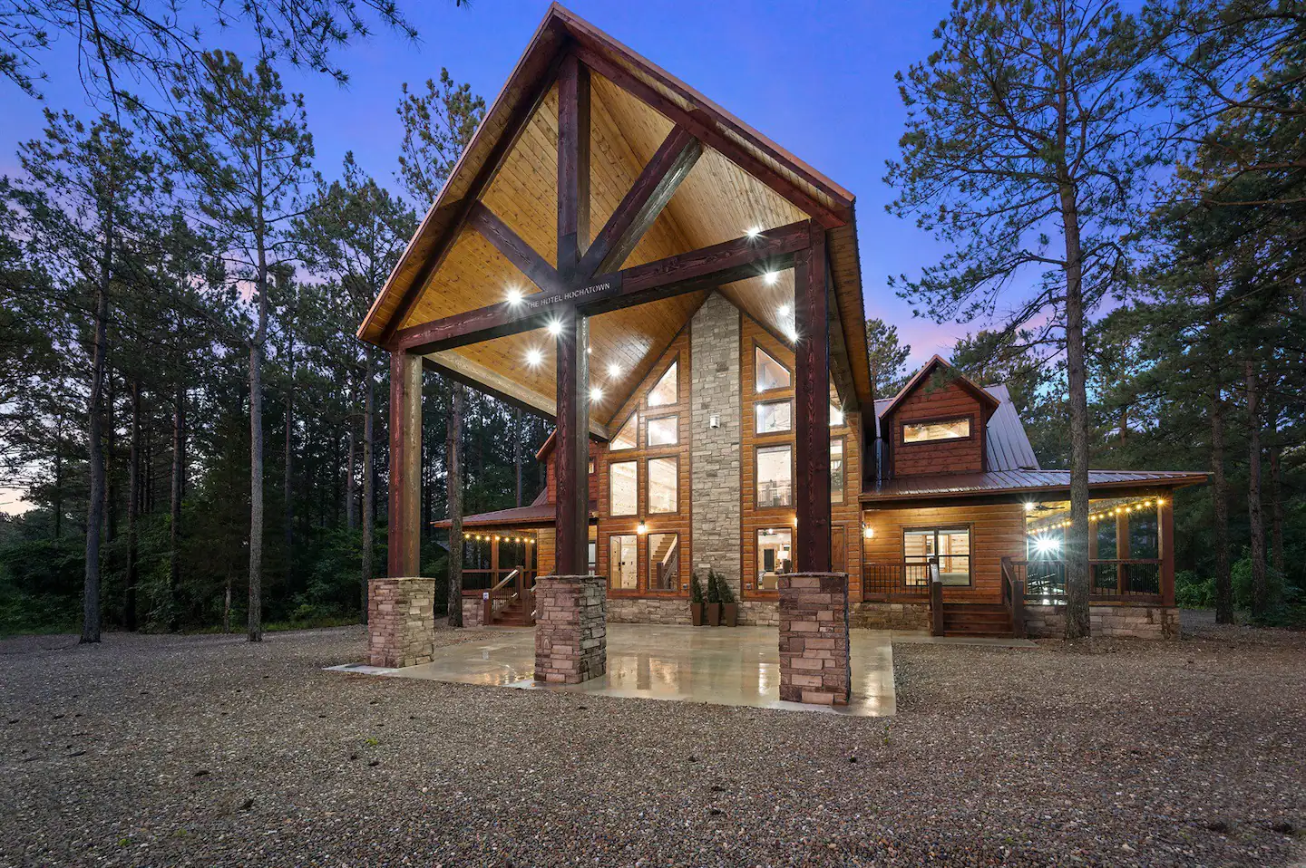 The grand entrance welcomes you with impressive towering beams resembling a hotel-style entrance.