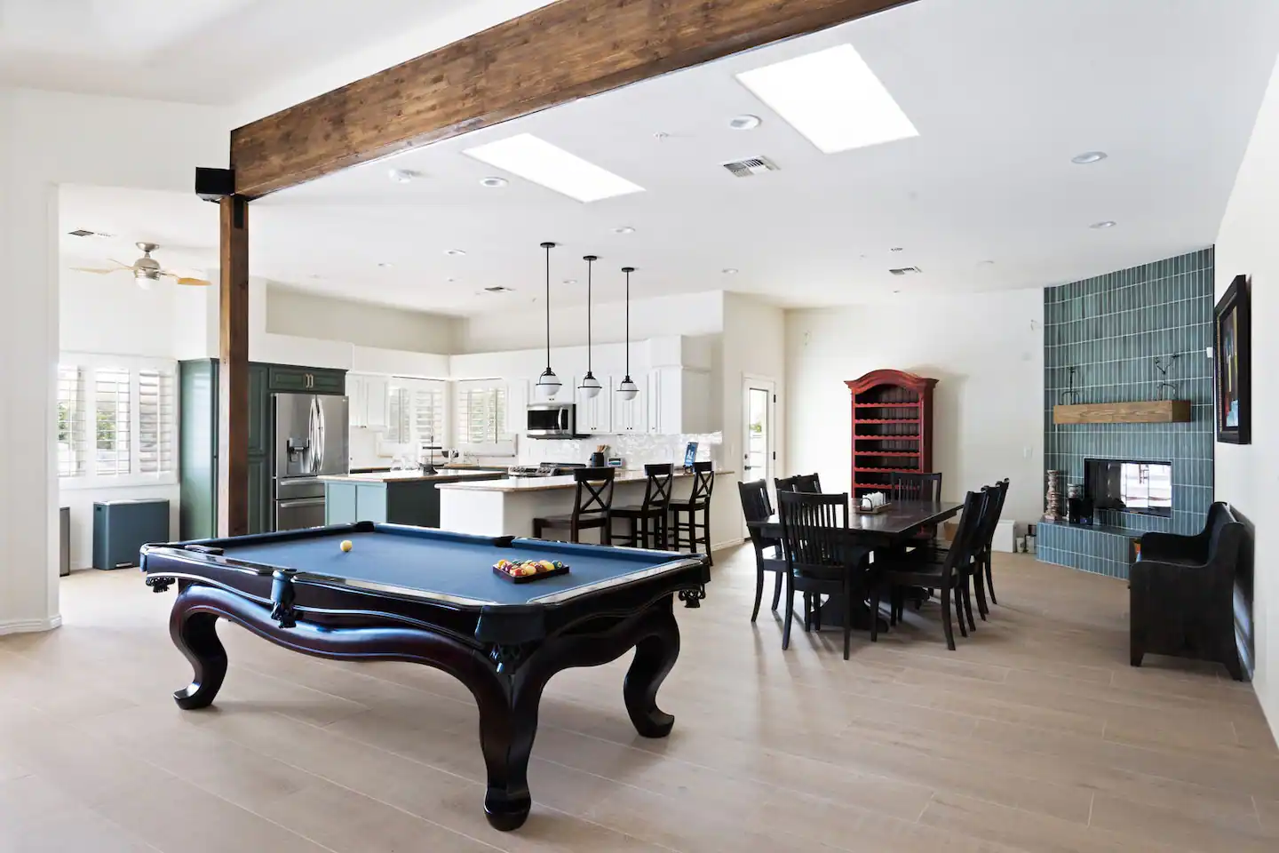 Enjoy a game of pool or dine in the designated area adjacent to the kitchen, all within the same living space.