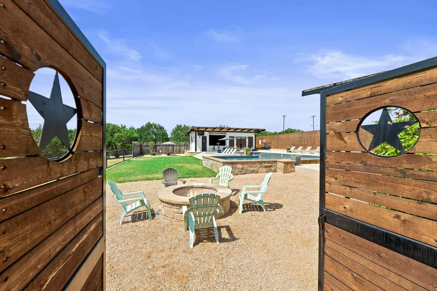 There is a firepit located by the poolside.