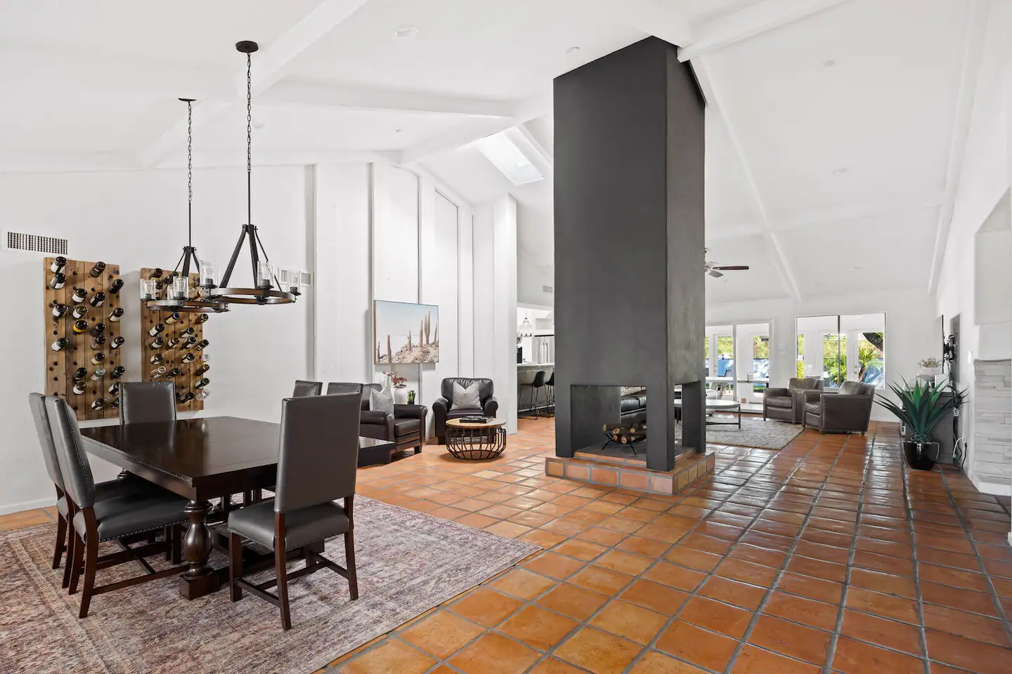 Experience our dining room area, with the living area visible in the background.
