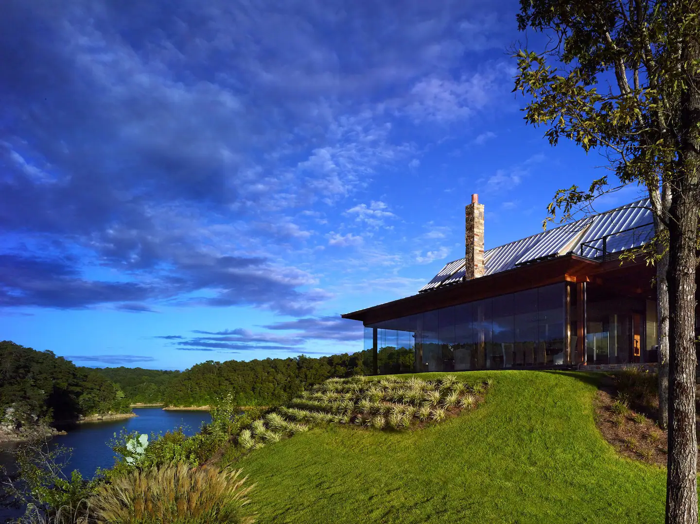 The property is situated on a point lot, offering breathtaking lake views from every angle.