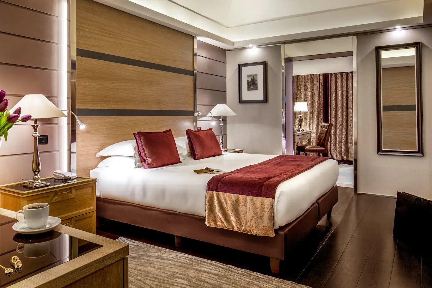 A warm and intimate bedroom with a comfortable bed, soft lighting, and tasteful decor, providing a tranquil and restful atmosphere.