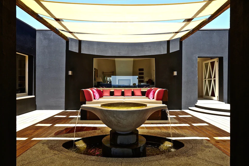 Elegant villa room with a soothing fountain centerpiece.