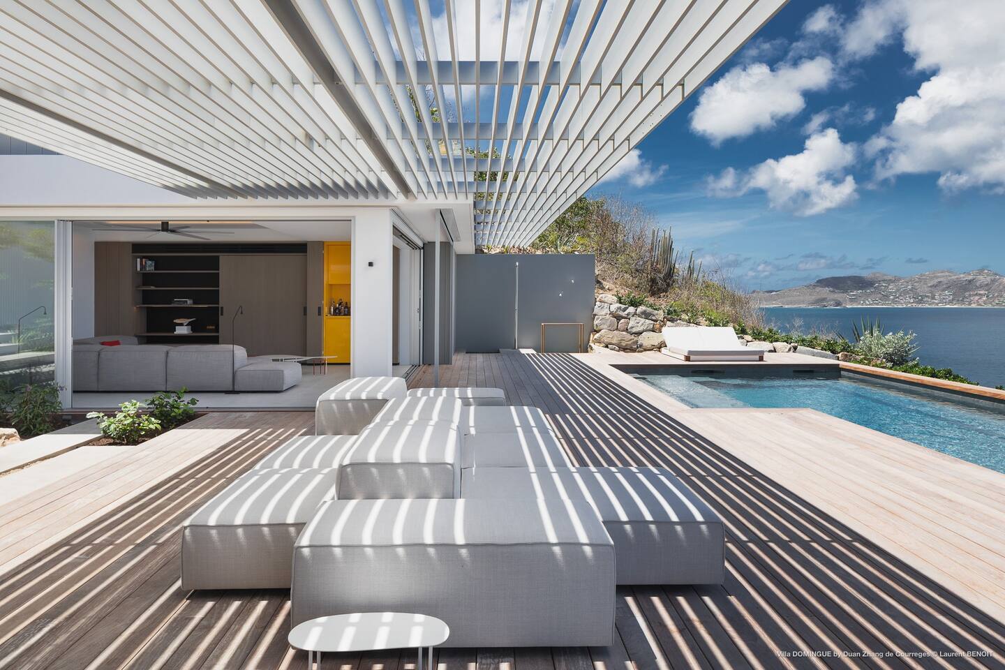 Outdoor patio of the villa, furnished with comfortable seating arrangements and offering a perfect spot for relaxation and entertainment.
