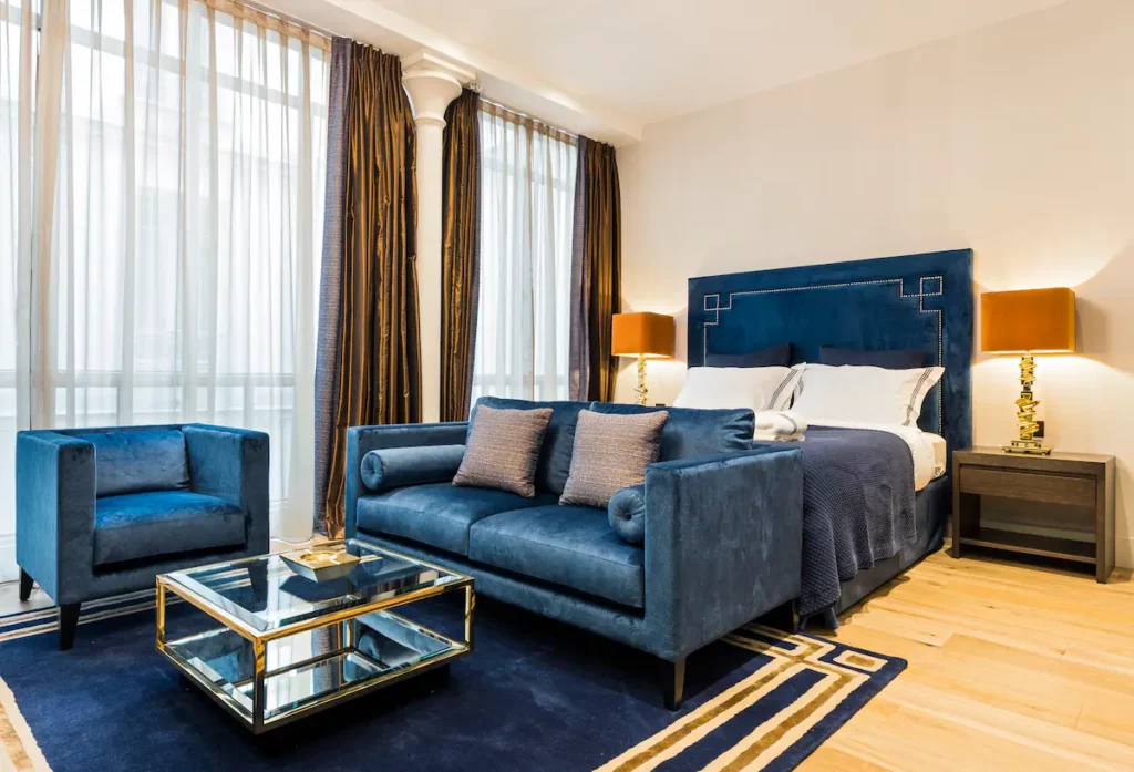 The living room has double glazed floor-to-ceiling windows.