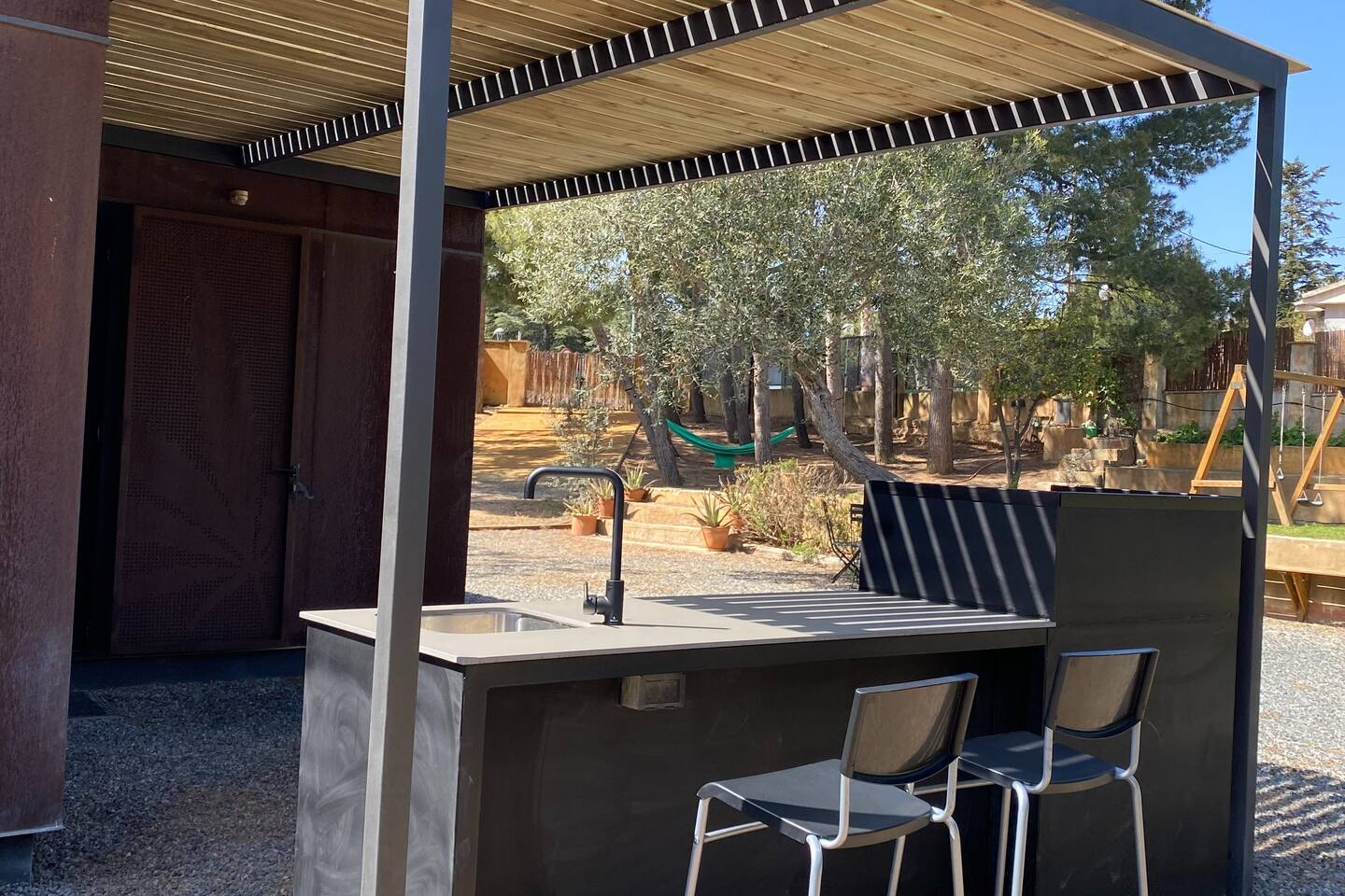 Large garden with new outdoor kitchen.