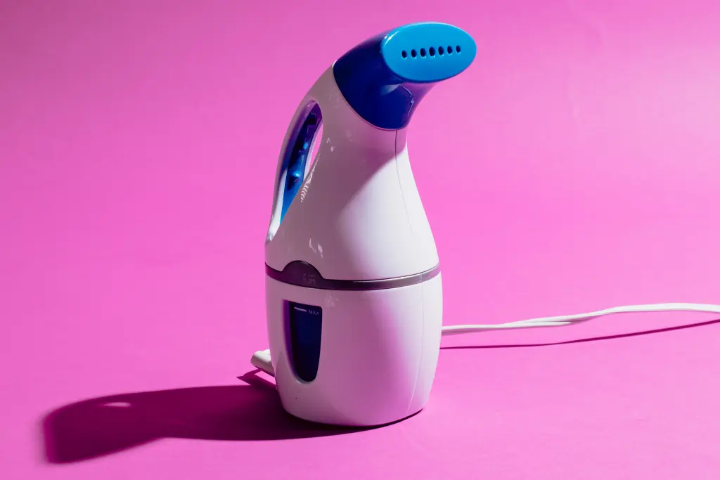 You don't have to wear wrinkly clothes when you travel with this portable clothes steamer
