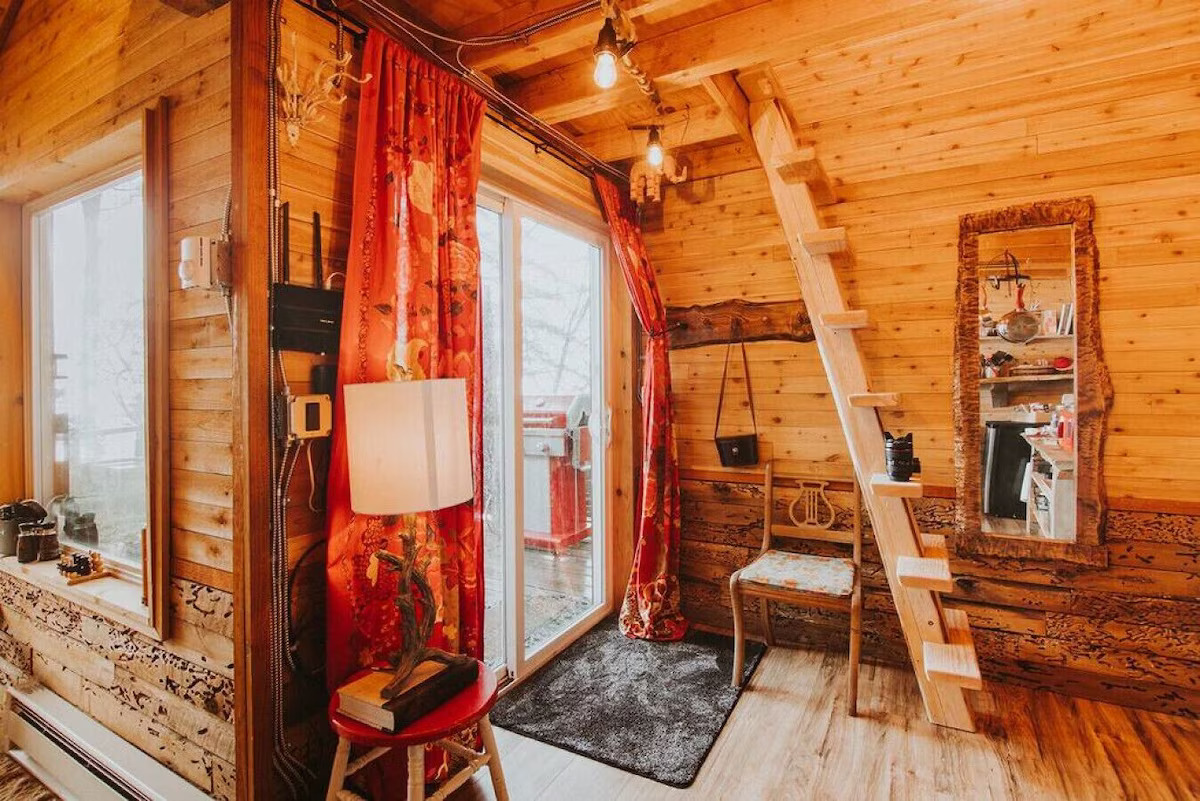 Door out to deck and stairs to loft