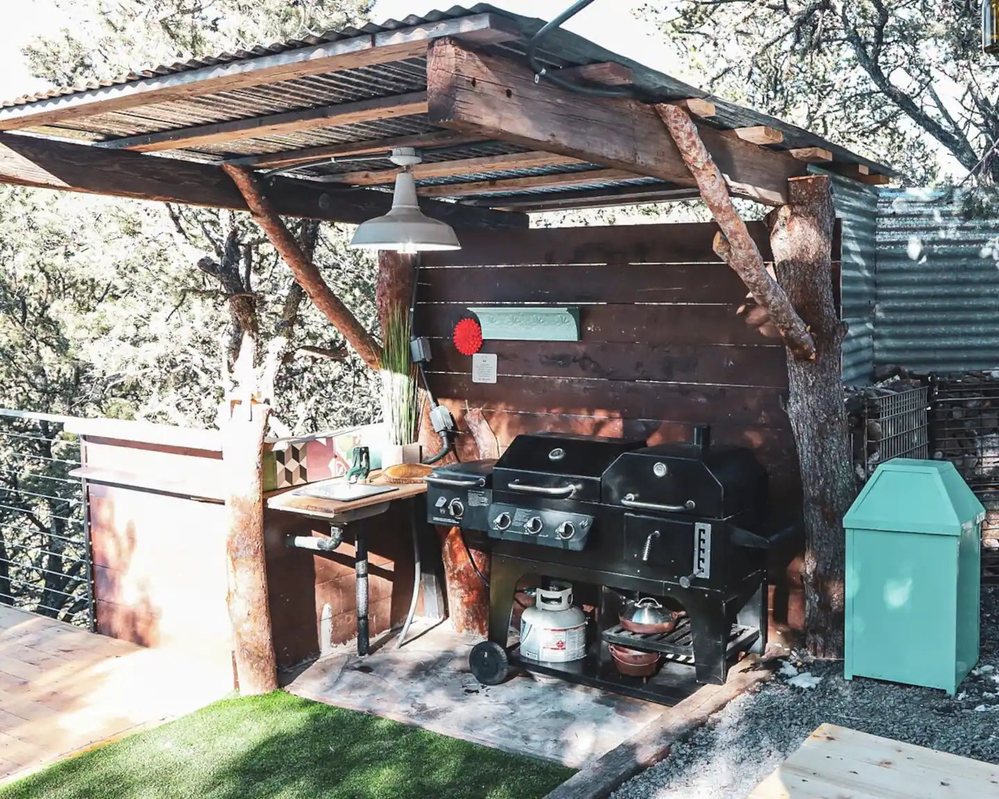 Space includes a patio area equipped with a gas grill and table.