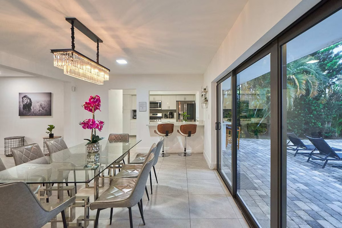 Elegant dining table next to the backyard..