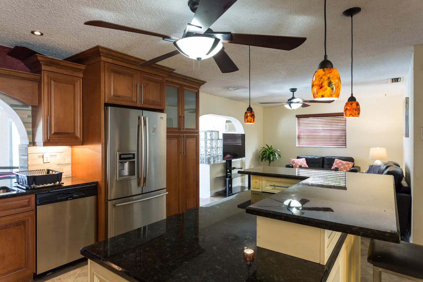Dining Room next to kitchen with Stainless Steal Appliances and Island with Granite Counter Tops and seating.
Kitchen with Stainless Steal appliances & Multi Level Island with Granite Counters Tops.