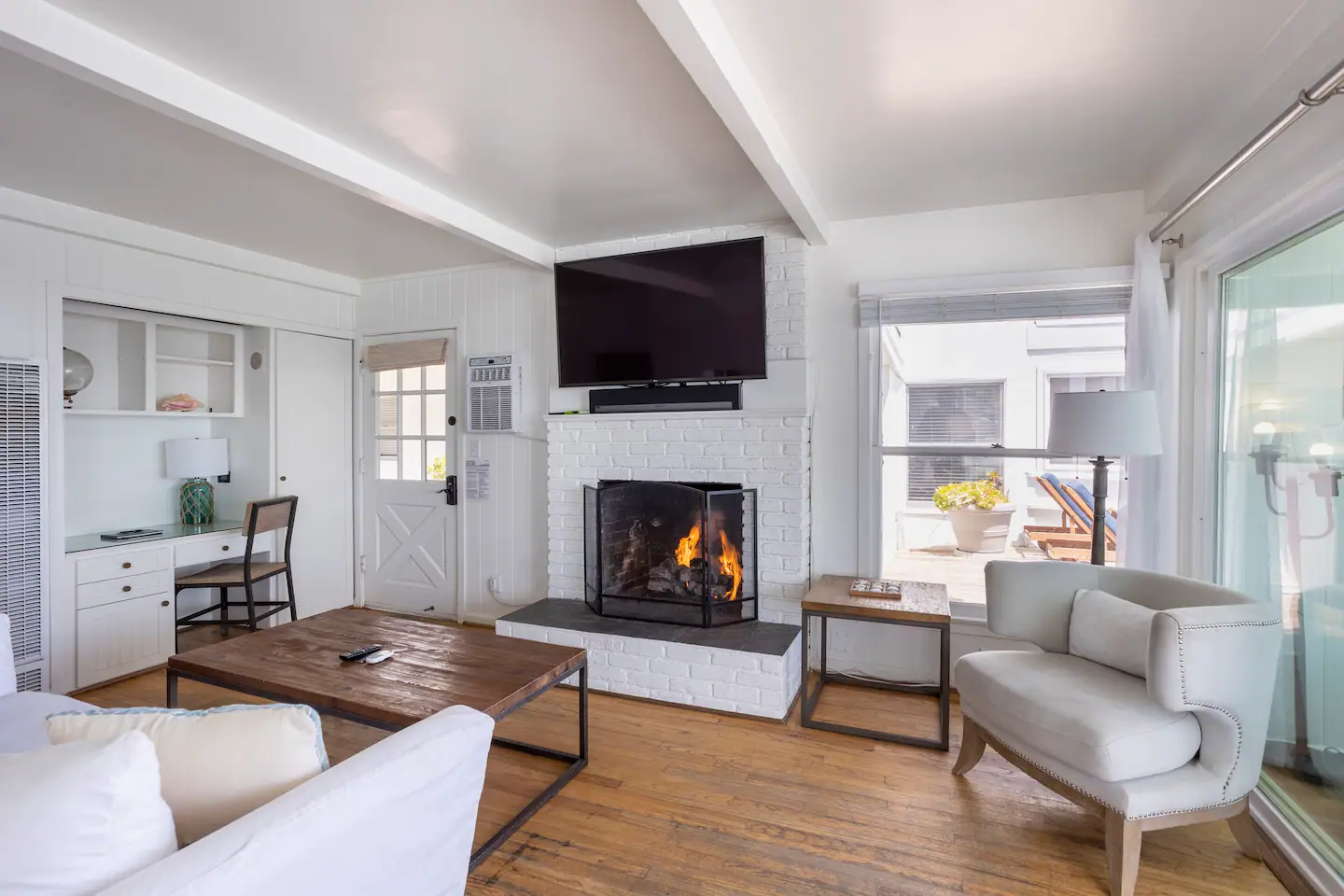 Living Room Flatscreen Smart TV with Apple TV. Working gas fireplace.