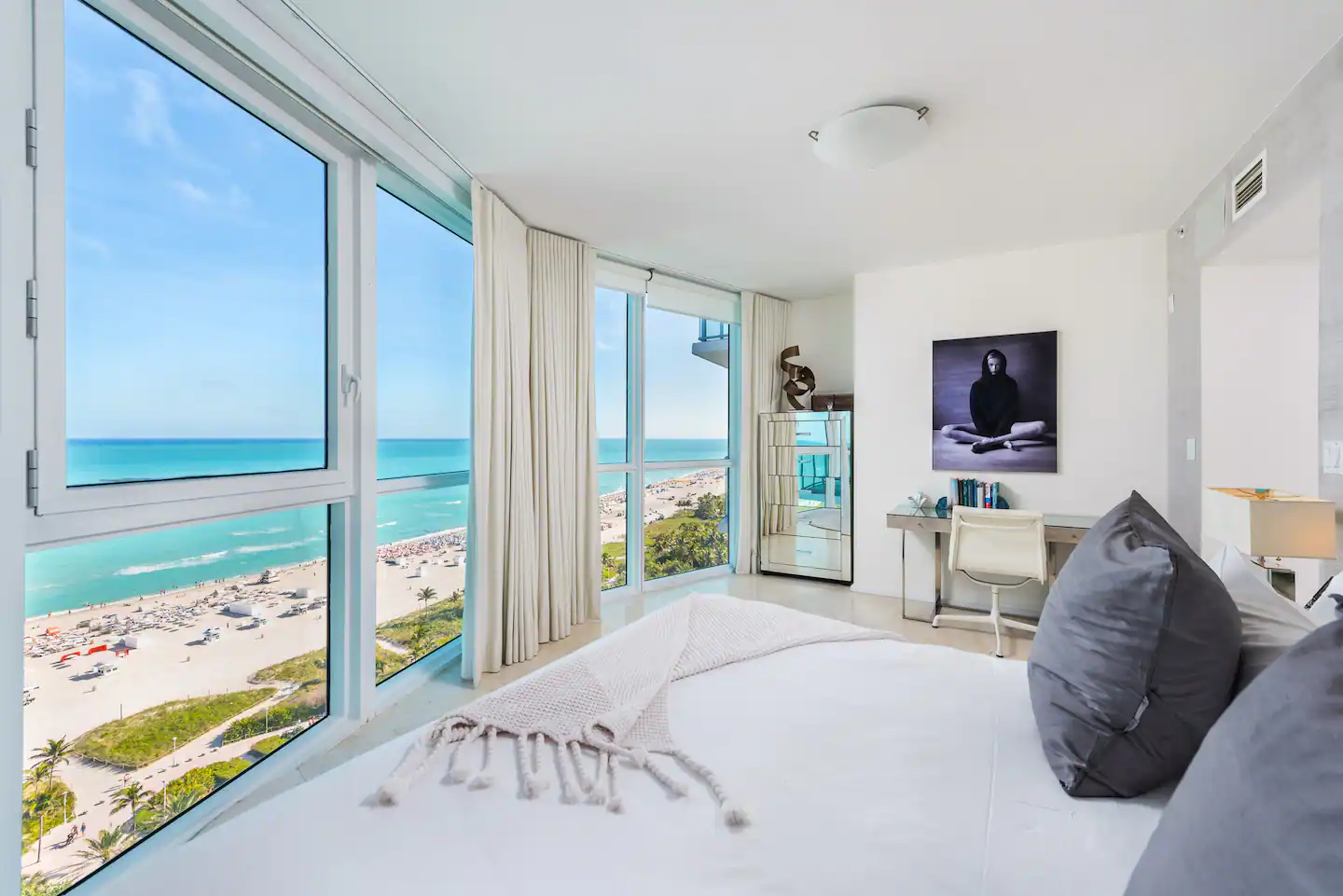 A honeymoon-worthy Primary suite with a king bed, jetted tub, and desk area