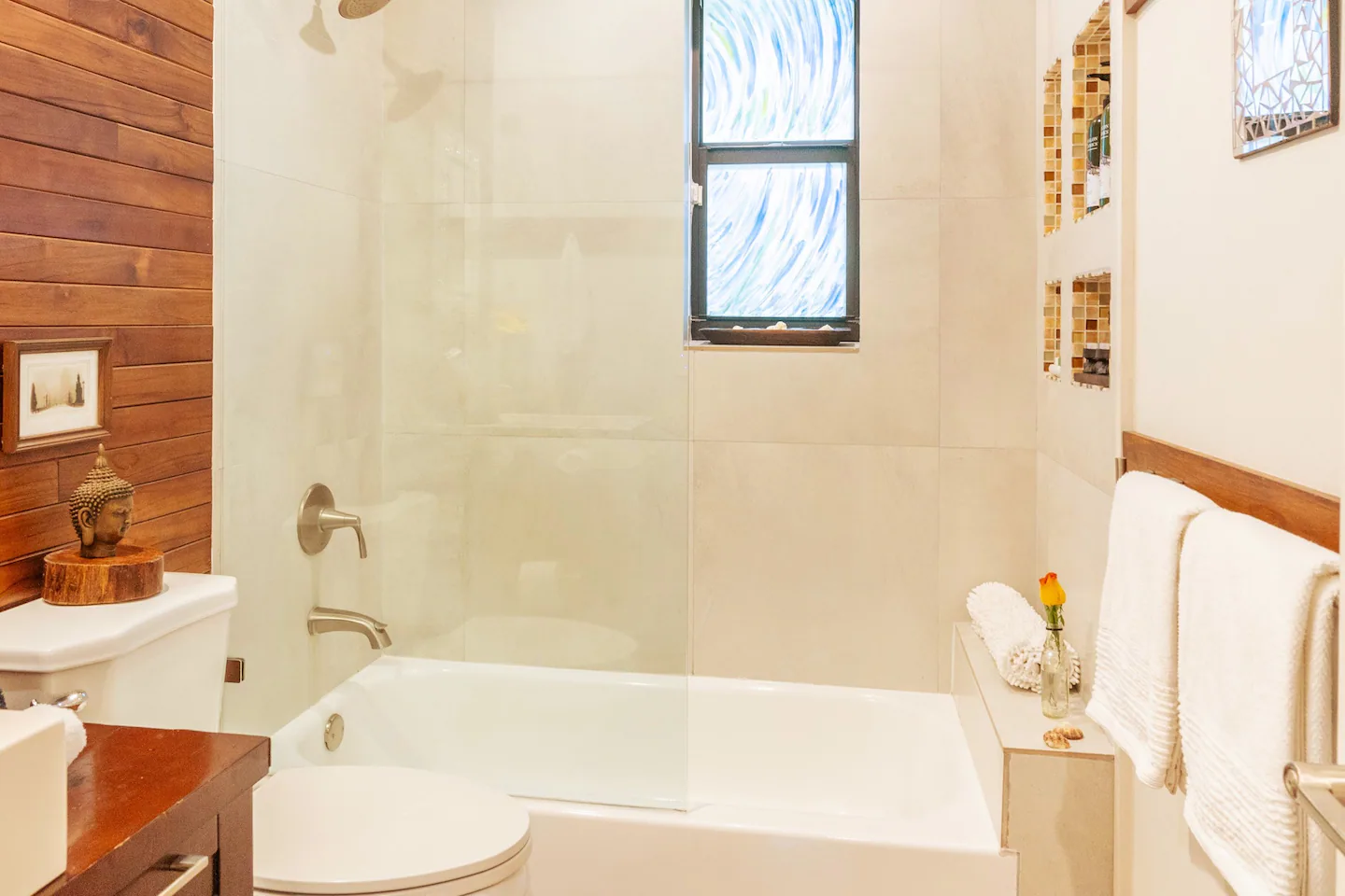Private bathroom with tub., towels. toiletries & newly painted windows