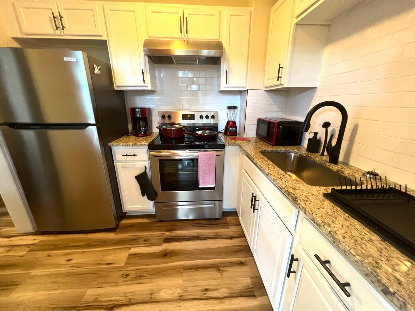 Kitchen is adequately stocked for basic cooking.