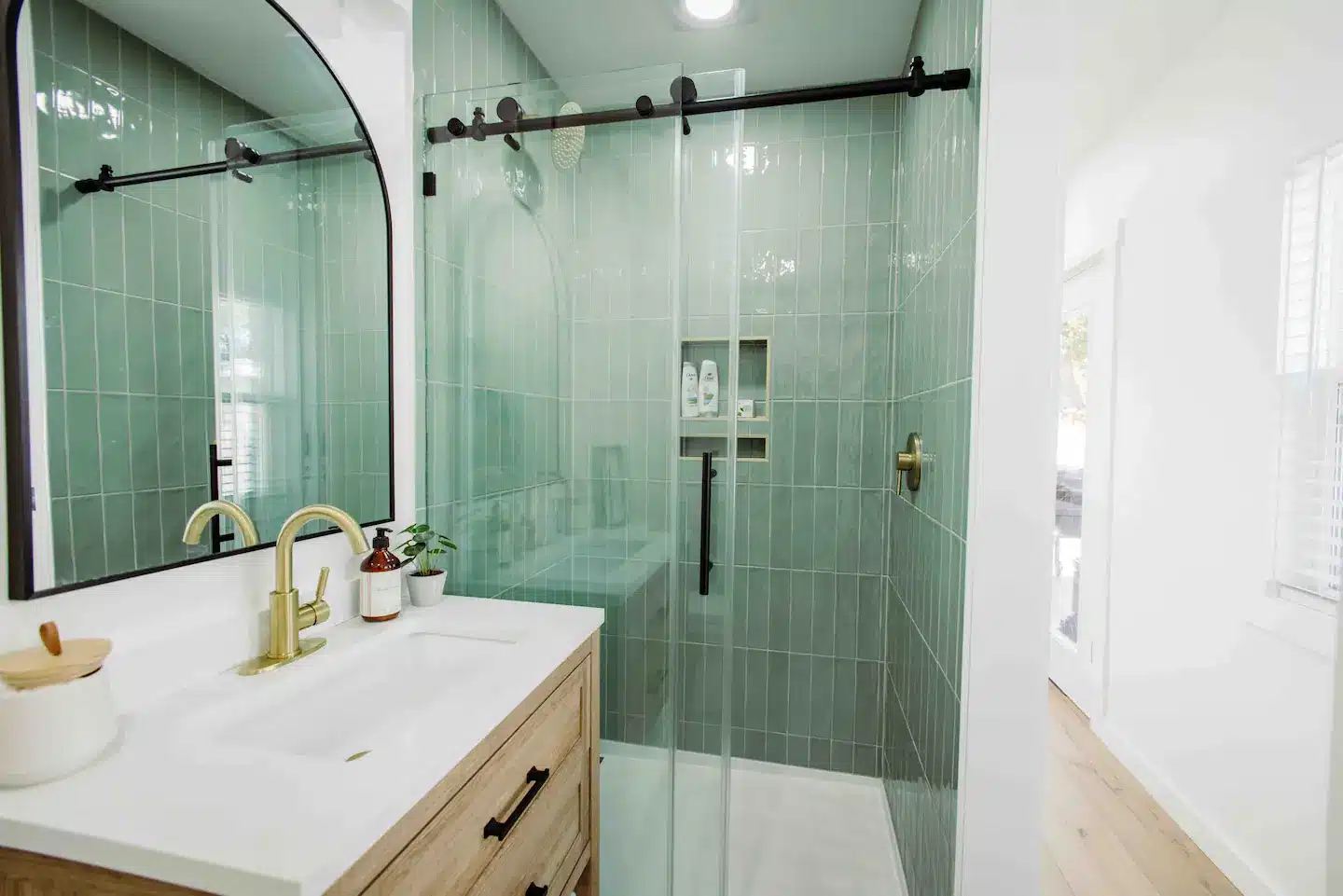 The bathroom has a fully stocked, full size stand up shower.