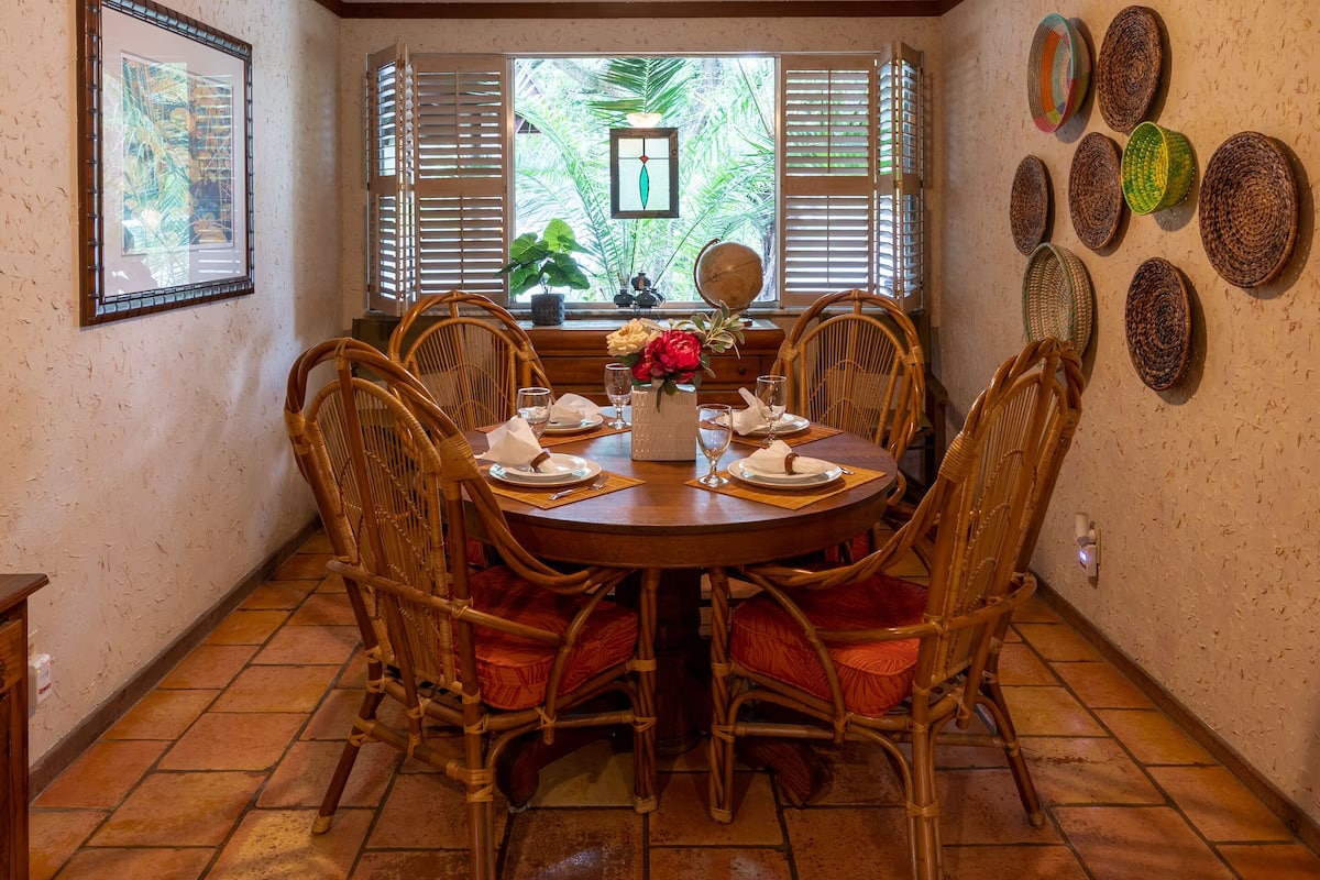 Dining room has seating for 4 -8 with table leaves and extra chairs.