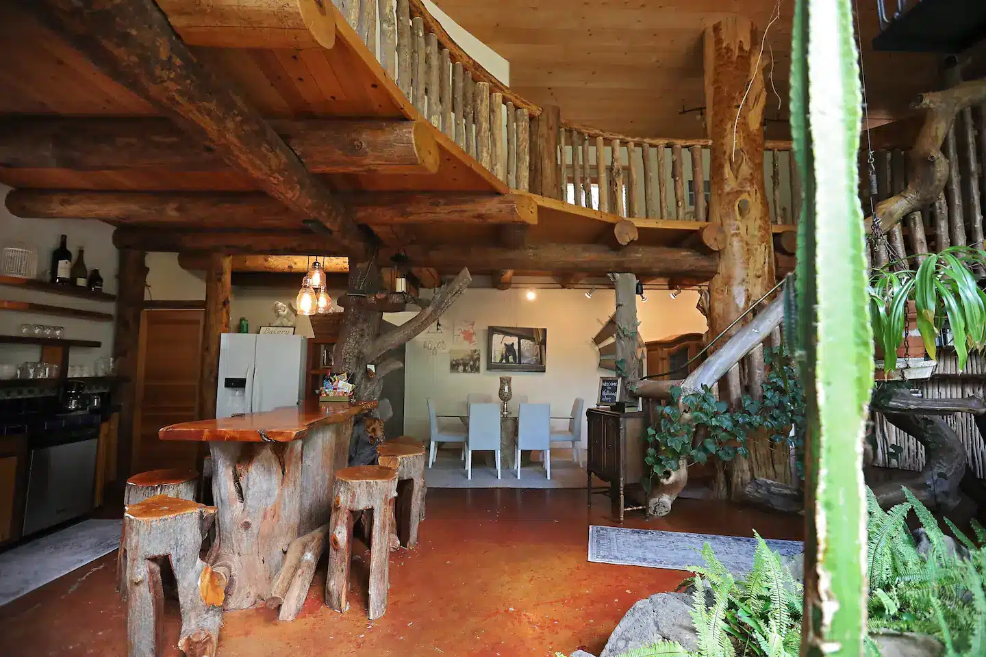 Custom kitchen, alligator juniperartist table and chairs open dining area