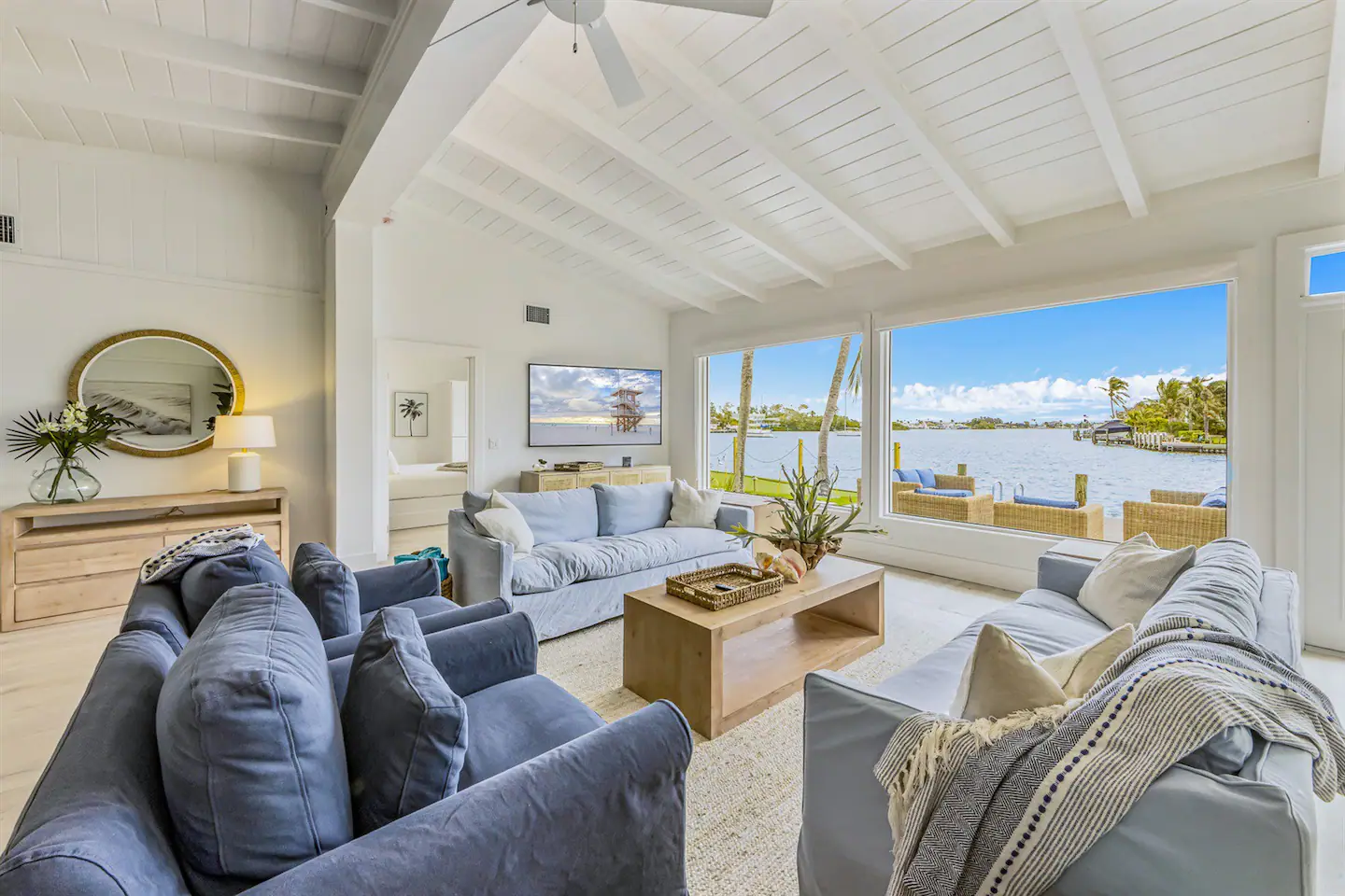 The living room opens up to a spacious back deck seating area overlooking Bimini Bay.