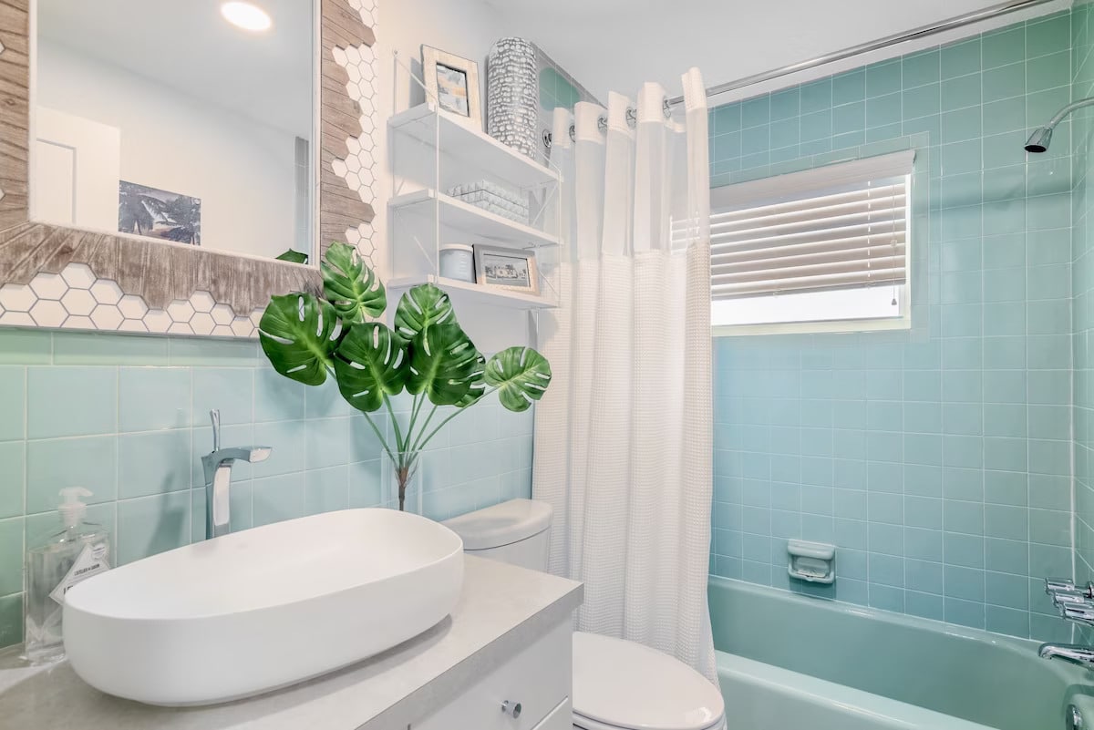Bathroom has restored 1960's vintage tiles.