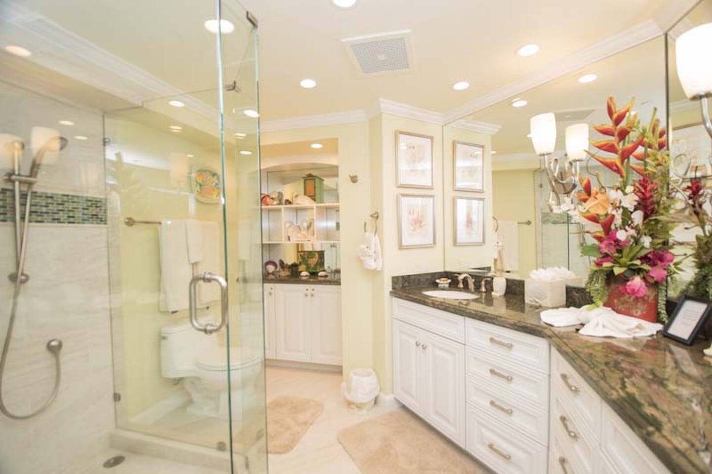 This en suite master bedroom features a large Roman style shower, two sink vanity and lots of space!