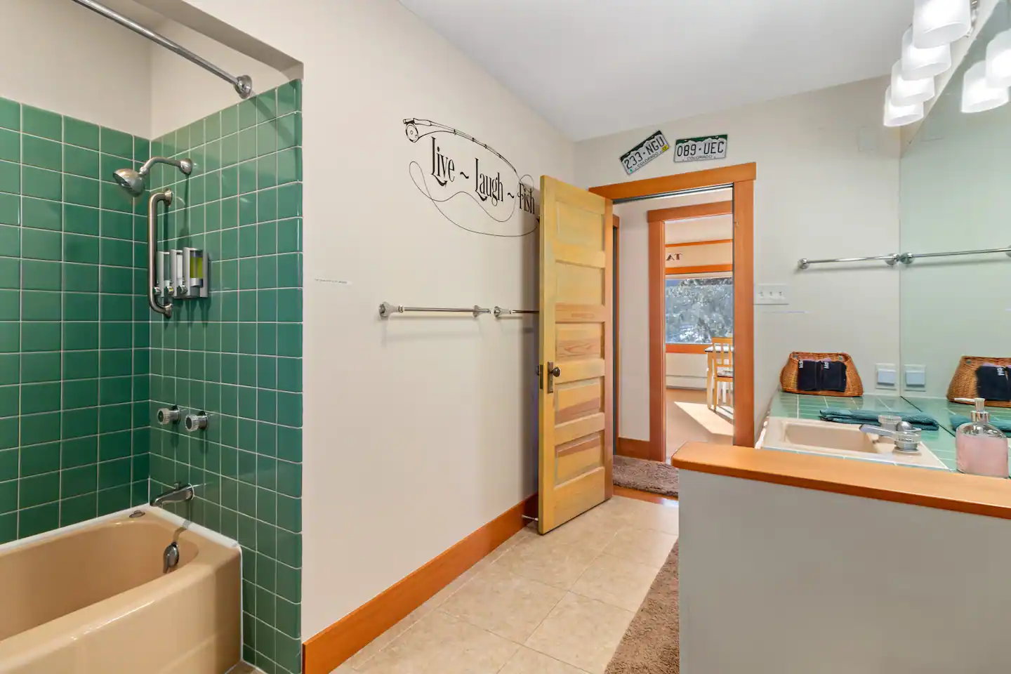 The full bath is decorated in Trout fishing decor.