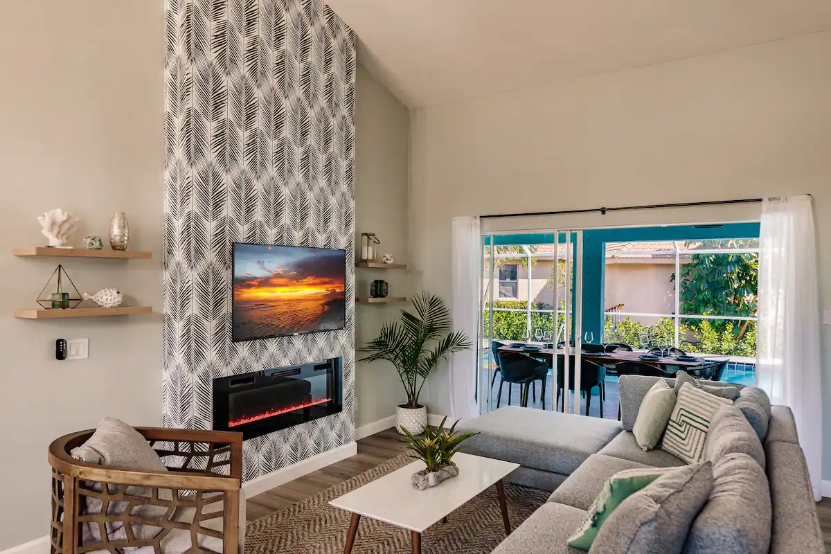 Main living area, adjacent to the kitchen with siders opening up to the amazing pool.