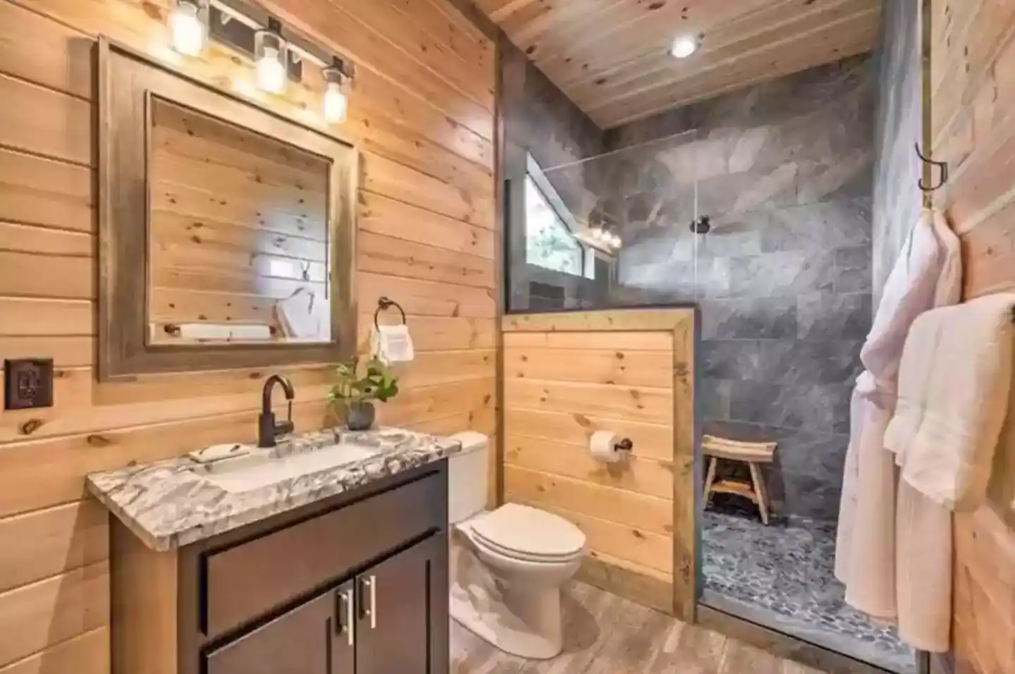 Enjoy the natural light shining through our spacious walk-in shower.