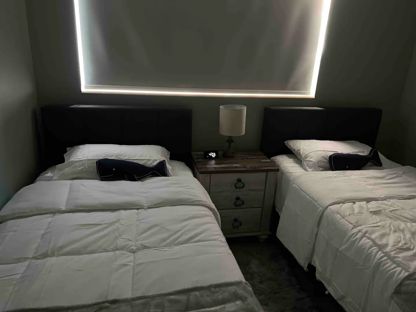 The first bedroom has 2 single beds.
